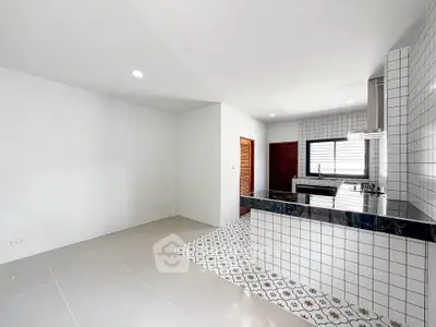 Modern kitchen with open layout and stylish tile flooring