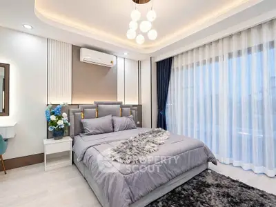 Luxurious bedroom with modern decor, plush bedding, and ambient lighting, perfect for relaxation and comfort.