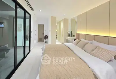 Luxurious modern bedroom with elegant decor and soft lighting