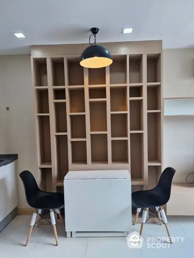 Modern study area with stylish shelving and chic chairs