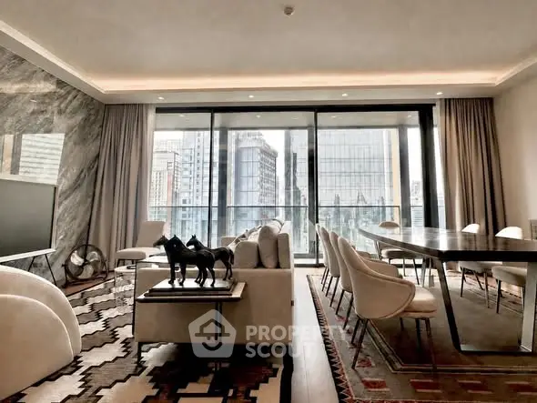 Luxurious living room with stunning city view, elegant decor, and spacious layout in modern high-rise apartment.