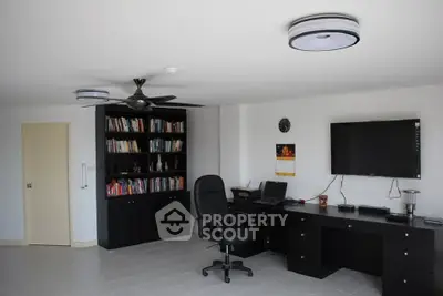 Spacious home office with modern desk and bookcase