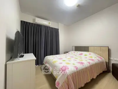 Cozy bedroom with floral bedding and modern decor