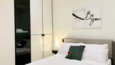 Elegant bedroom with modern decor and stylish wardrobe, perfect for a cozy and luxurious living experience.