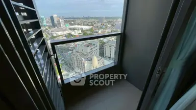 Stunning high-rise balcony view overlooking cityscape with modern architectural design.
