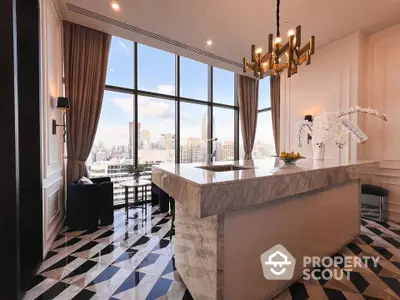 Luxurious modern kitchen with stunning city view and elegant marble island