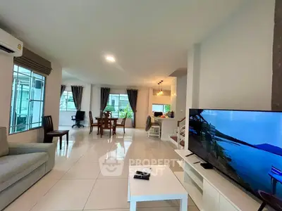 Spacious modern living room with open layout and large windows