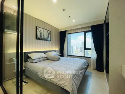 Modern bedroom with city view, large window, and stylish decor in urban apartment.