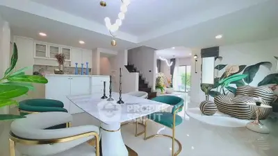 Luxurious open-plan living room with modern decor and elegant dining area