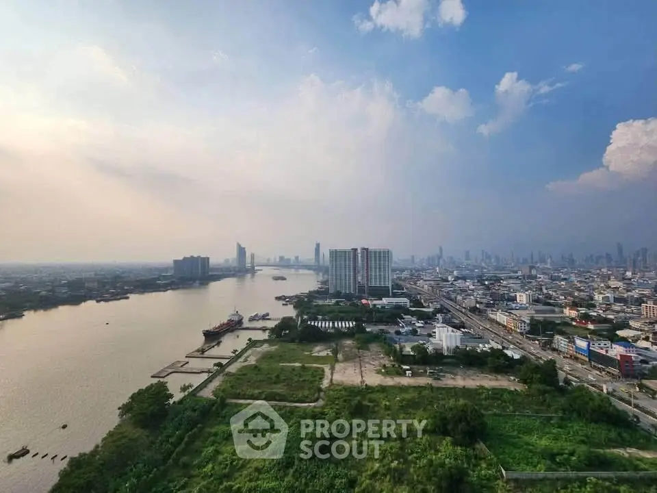 Stunning panoramic cityscape view with river and skyline, perfect for urban living enthusiasts.