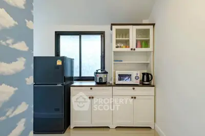 Charming kitchen with modern appliances and ample storage space