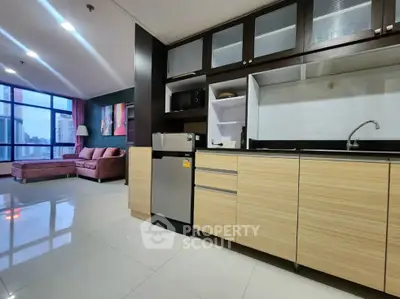 Modern open-layout kitchen and living room with city view in luxury apartment
