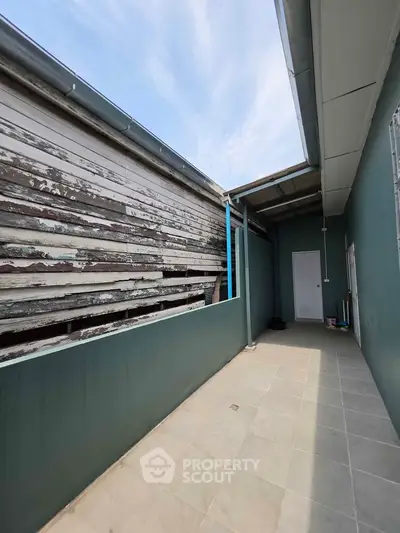 Spacious outdoor corridor with modern design and sky view