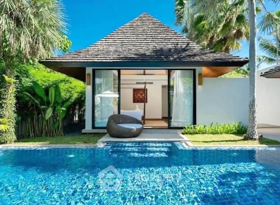 Luxurious tropical villa with private pool and lush garden, perfect for serene living.