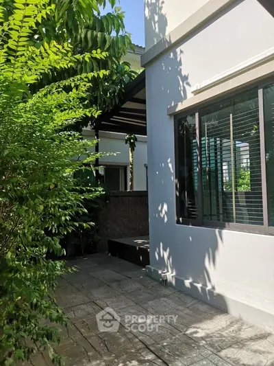 Charming garden view with lush greenery and modern exterior design