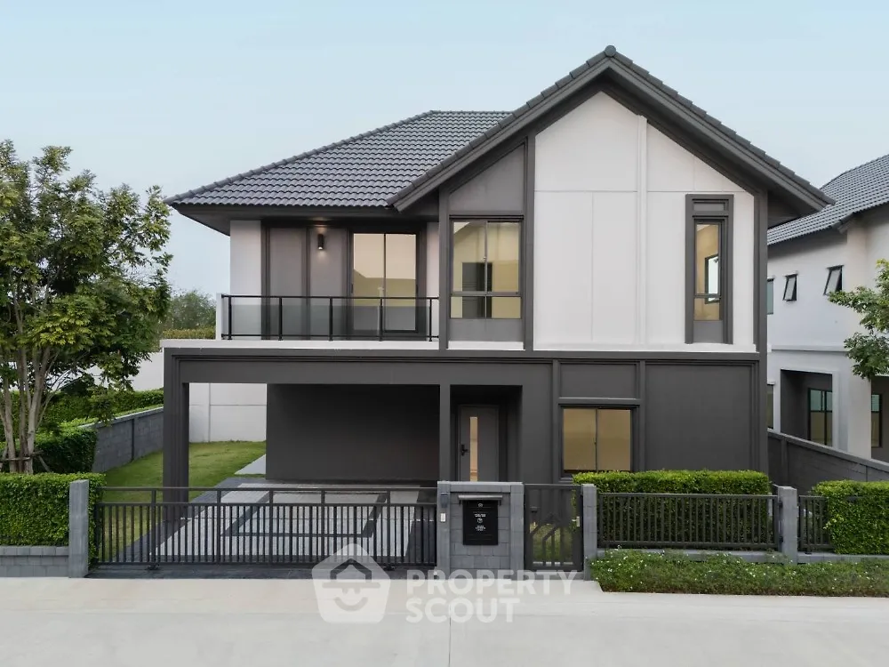 Modern two-story house with sleek design and spacious front yard