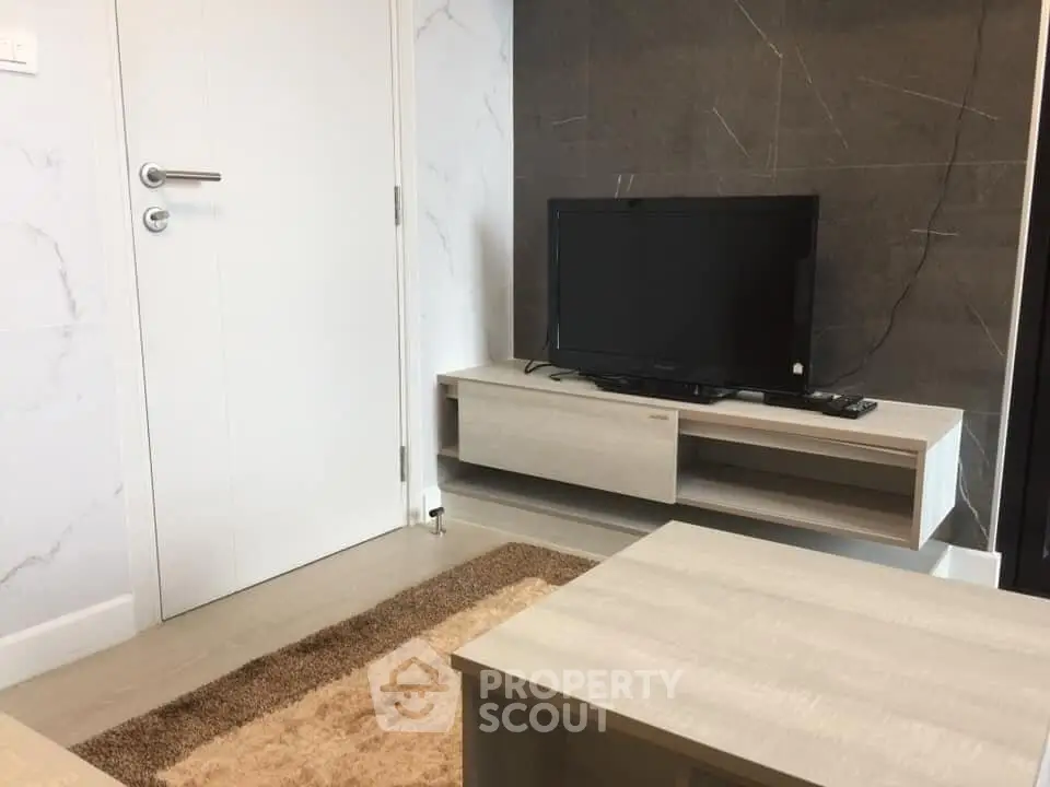 Modern living room with sleek TV stand and contemporary decor