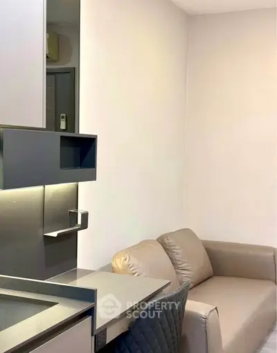 Modern compact living room with sleek furniture and integrated workspace