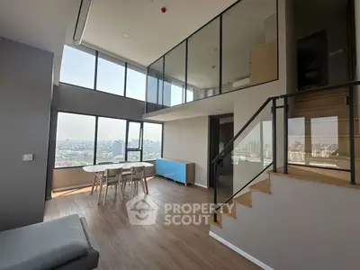 Stunning modern living room with floor-to-ceiling windows and city view