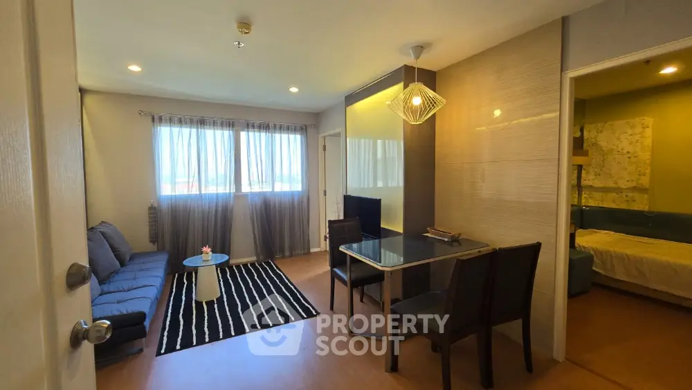 Modern living room with stylish decor and adjacent bedroom in a cozy apartment