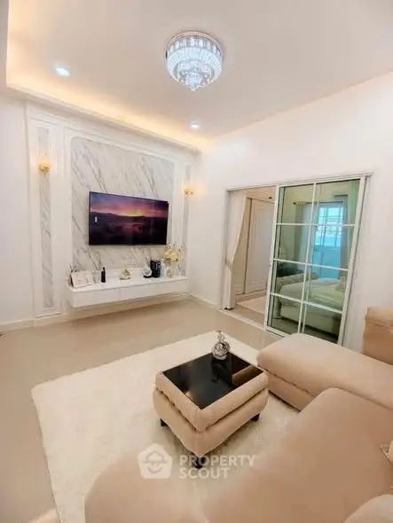 Elegant living room with modern decor and plush seating