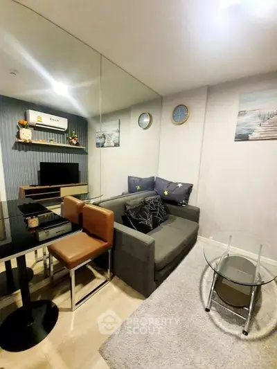 Modern living room with stylish decor and cozy seating area, perfect for relaxation and entertainment.