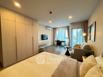 Spacious modern bedroom with large windows and elegant furnishings