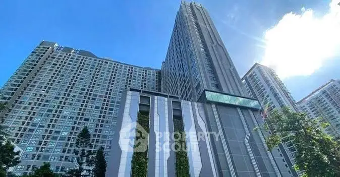 Stunning high-rise building with modern architecture against a clear blue sky.