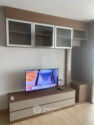 Modern living room with sleek TV unit and stylish storage cabinets