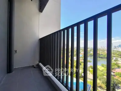 Spacious balcony with stunning city and river views, perfect for relaxation and enjoying the skyline.