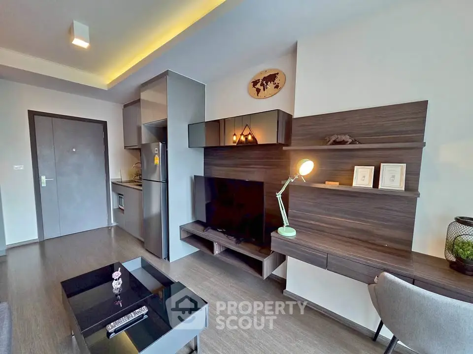 Modern living room with sleek furniture and integrated kitchen area