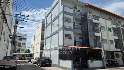 Modern multi-story apartment building with parking in urban setting