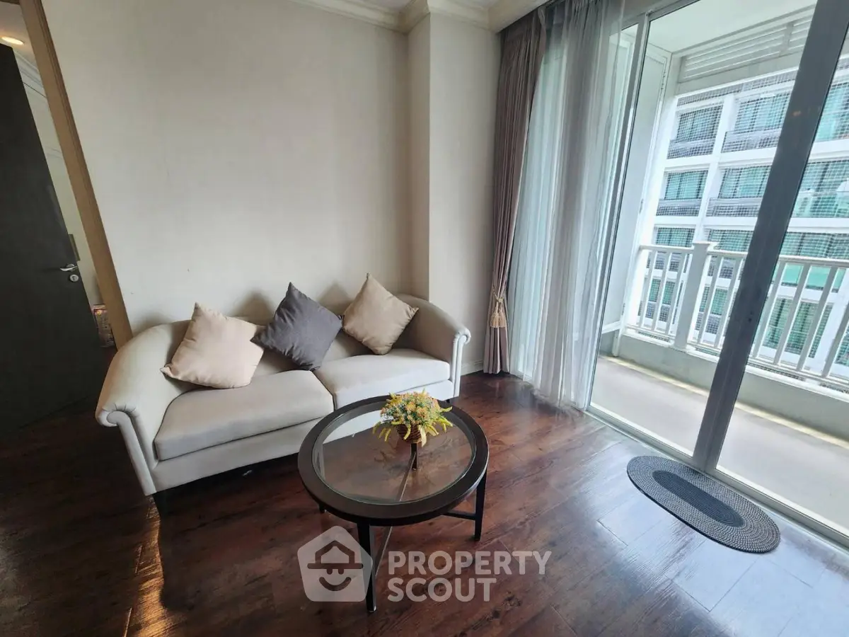 Cozy living room with elegant sofa and balcony view in modern apartment