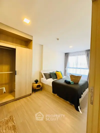 Spacious bedroom with modern decor and natural light