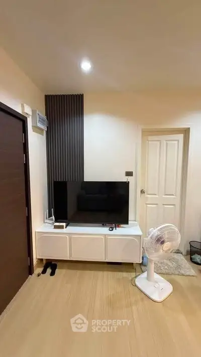 Modern living room with sleek TV setup and stylish decor