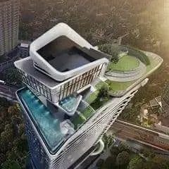 Stunning aerial view of a modern high-rise building with rooftop garden and pool.