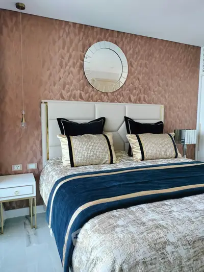 Luxurious bedroom with elegant decor and plush bedding