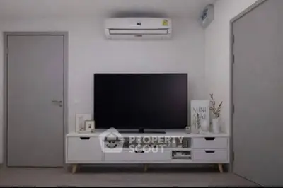 Modern living room with sleek TV setup and minimalist decor