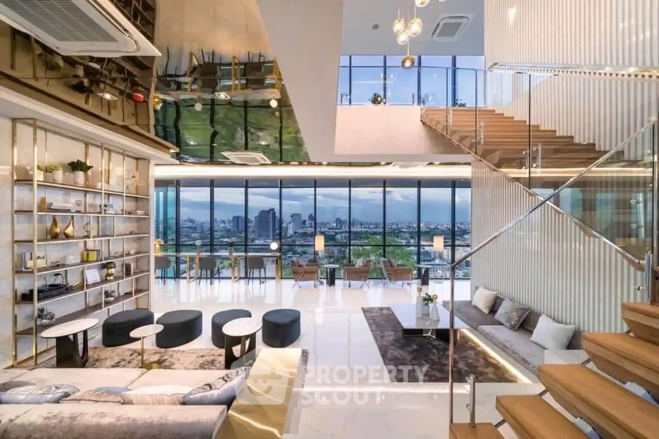 Luxurious modern living room with stunning city view and elegant staircase