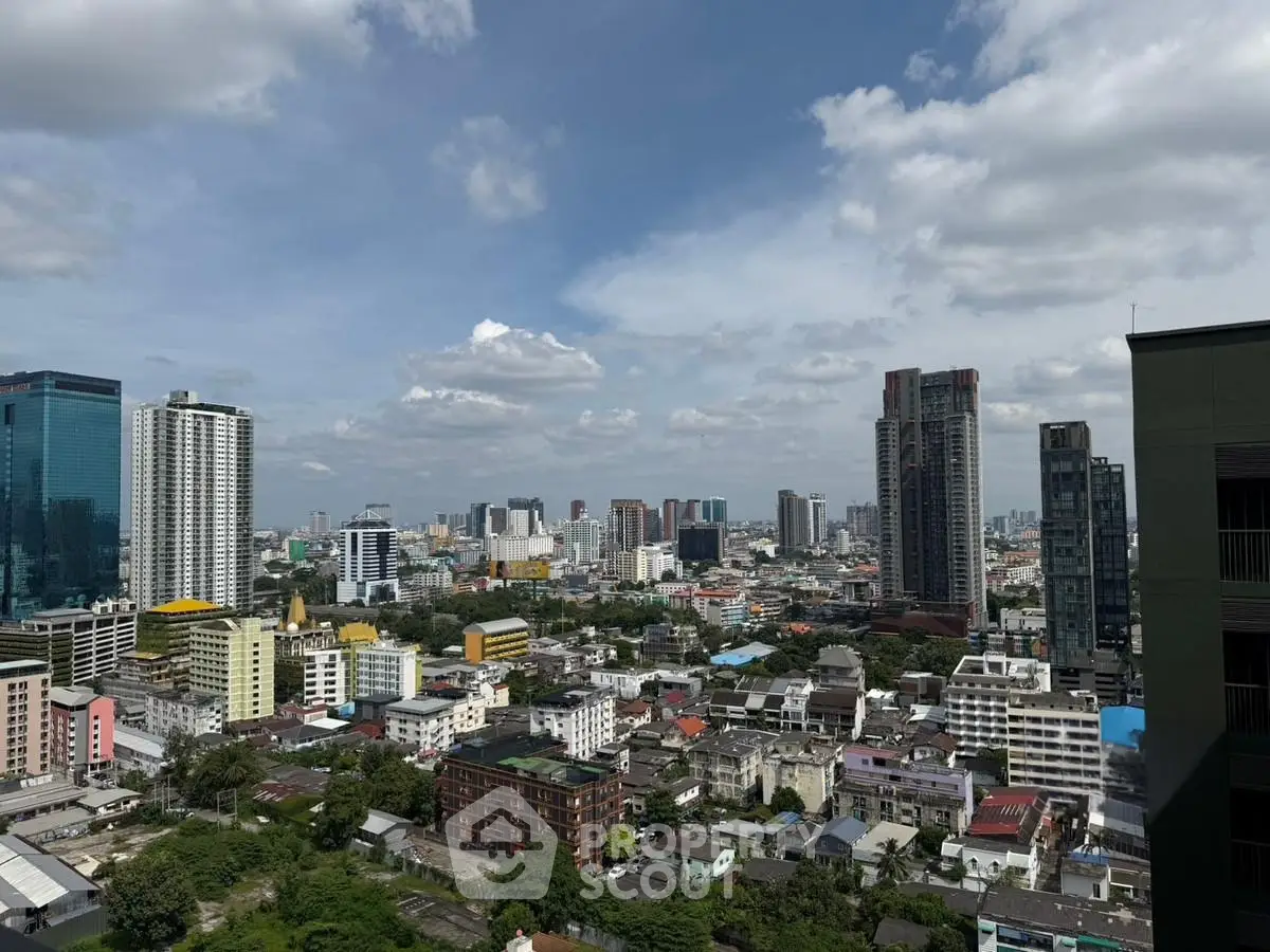 Stunning cityscape view from high-rise building showcasing urban skyline and vibrant city life.
