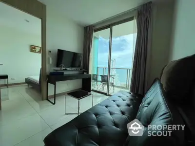 Modern living room with ocean view balcony in high-rise apartment