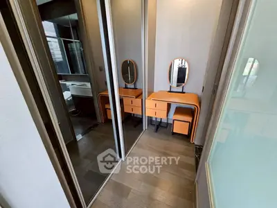 Stylish bedroom with mirrored closet and modern vanity desk