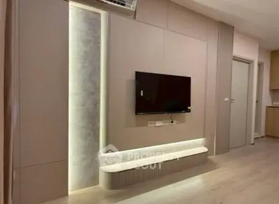 Modern living room with sleek TV setup and ambient lighting