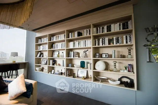 Luxurious living room with stylish built-in bookshelf and modern decor
