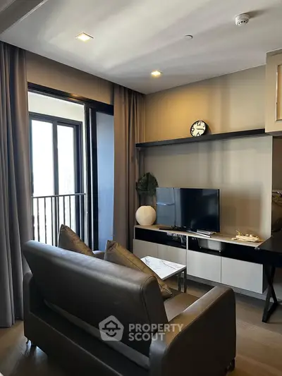 Modern living room with sleek furniture and balcony view