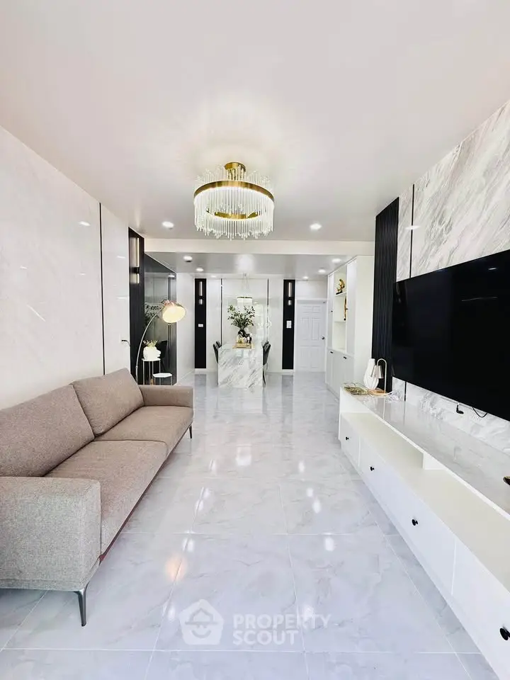 Luxurious living room with modern decor and elegant chandelier