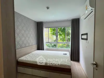 Modern bedroom with large window and stylish decor