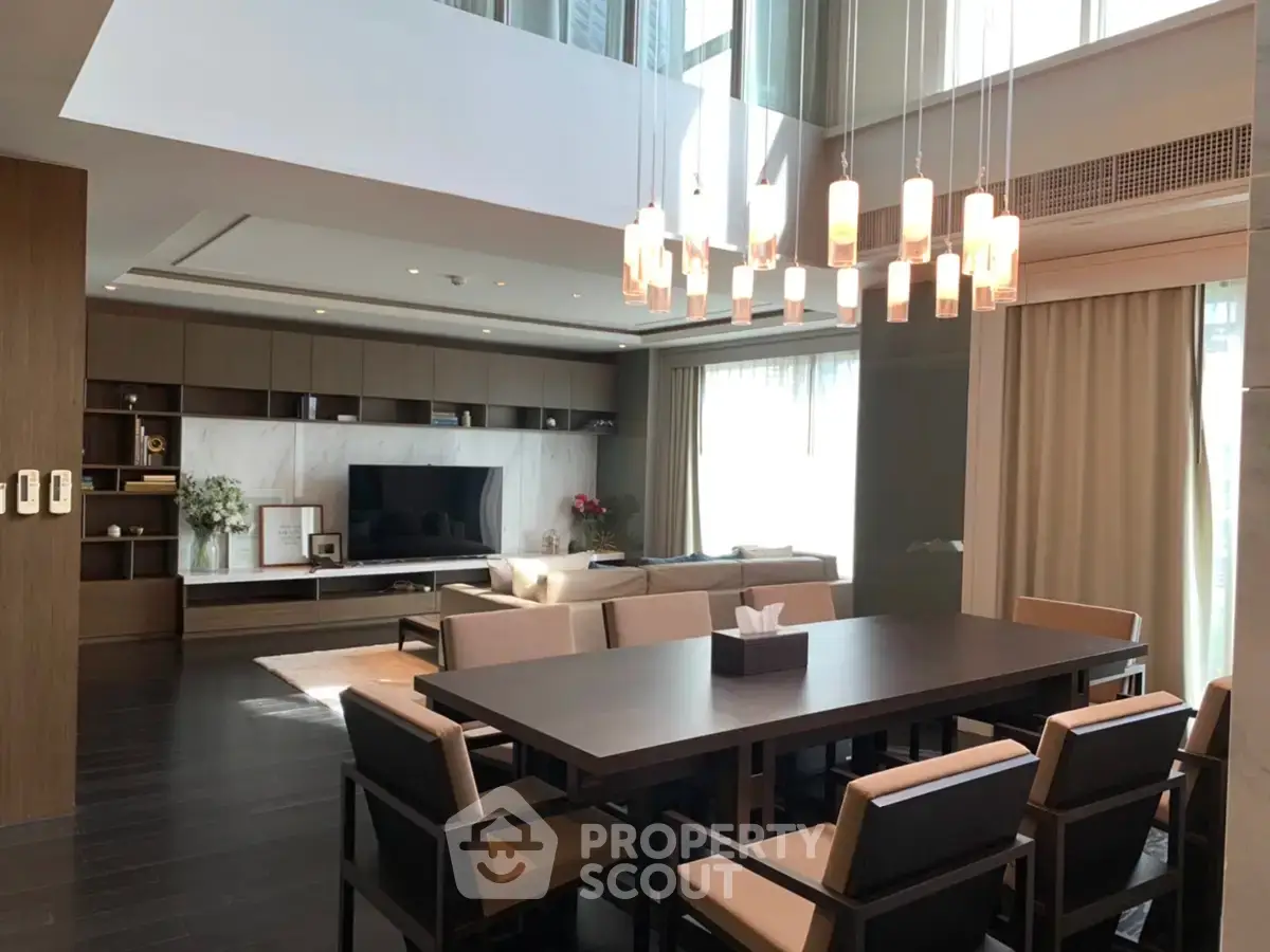 Luxurious modern living room with elegant dining area and stylish lighting in a high-end apartment.