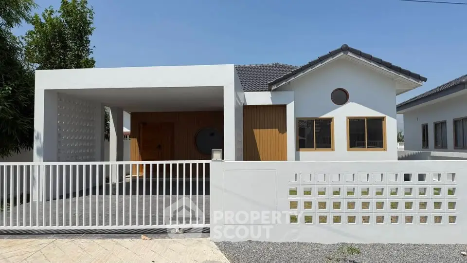Modern single-story house with minimalist design and spacious driveway
