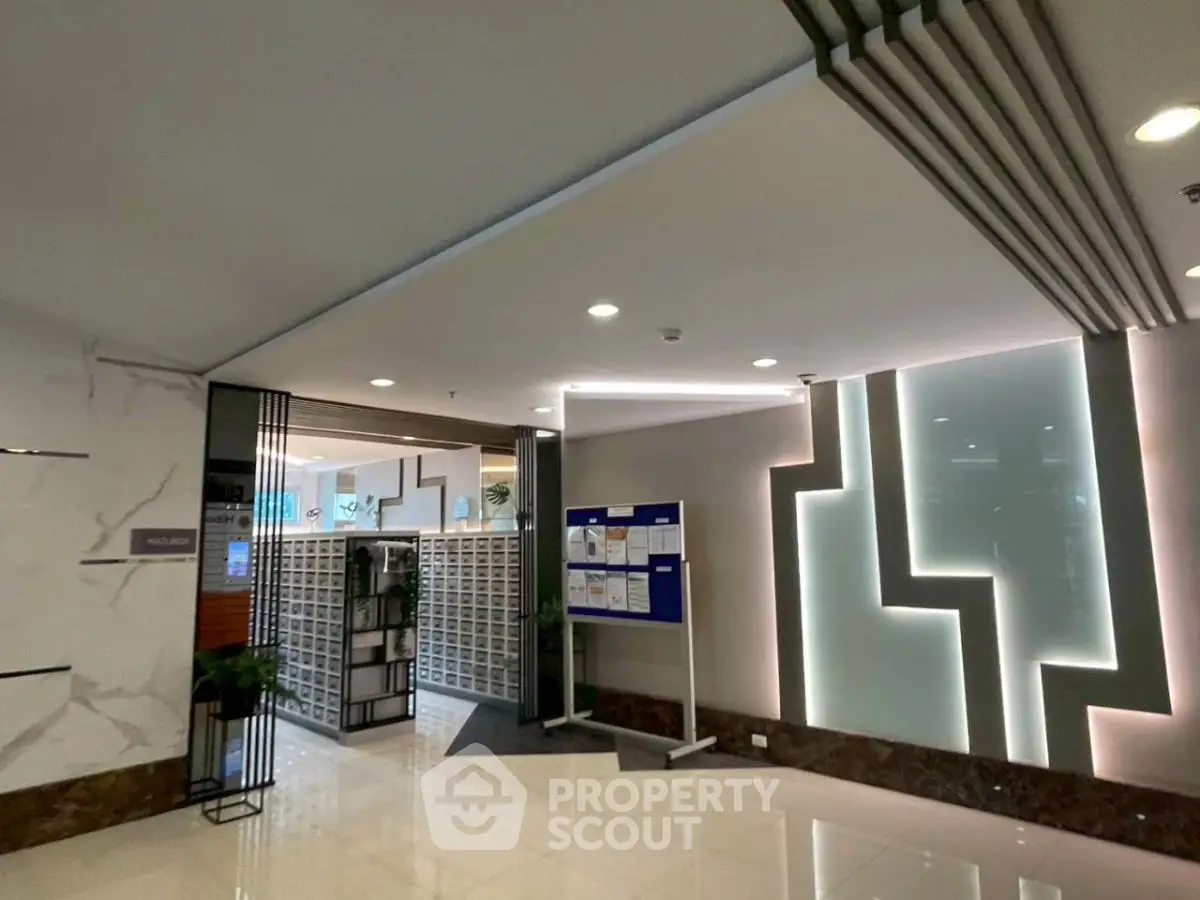 Modern building entrance with sleek design and stylish lighting